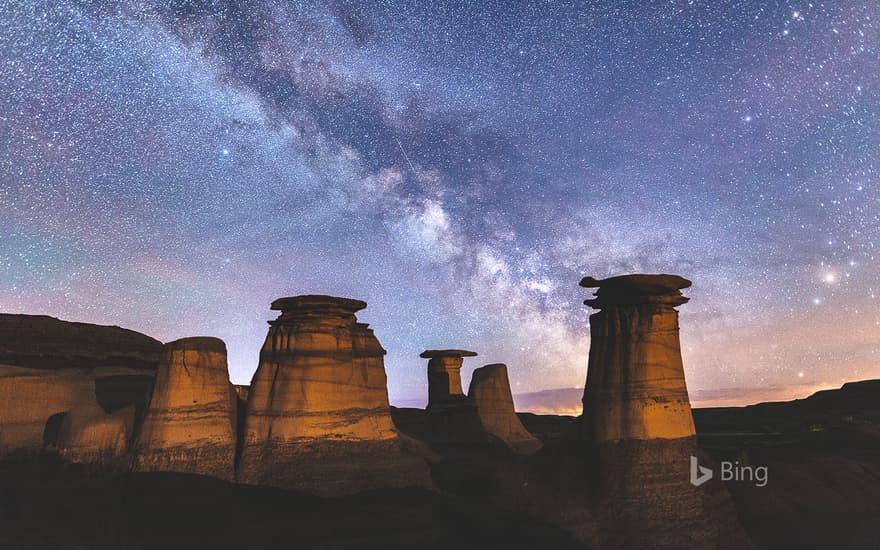 Milky Way over hoodoo rock formations in the Canadian Badlands, Drumheller, Alberta, Canada